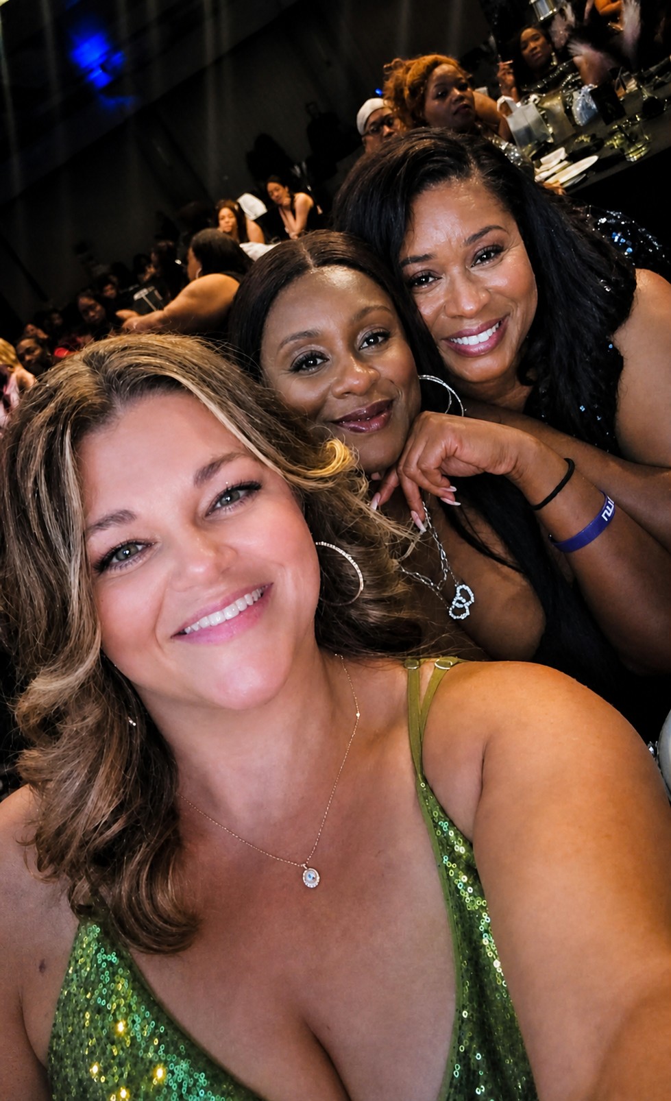 Three friends taking a selfie at the Let's Do It Again Prom